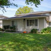 a house view with a garden space