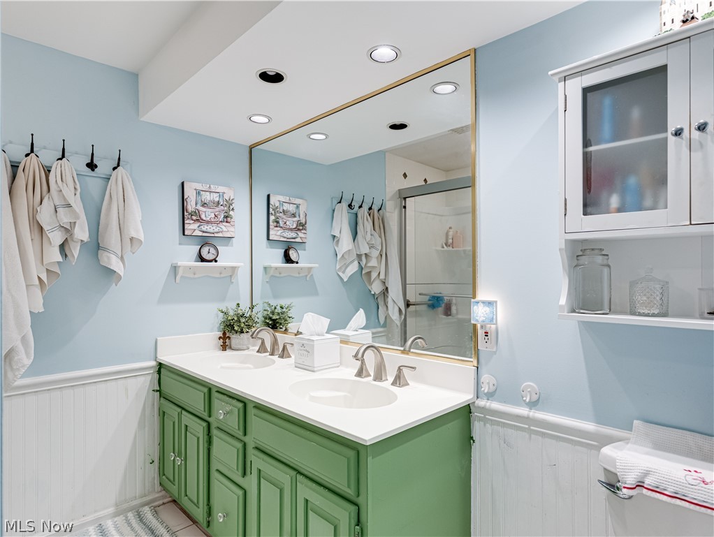 2000 Wiltshire Road Akron, OH 44313 - Photo 25 of 27 Bathroom with dual vanity and an enclosed shower