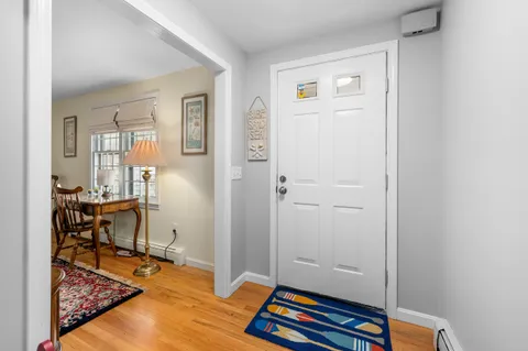 a room with lounge chair and a window