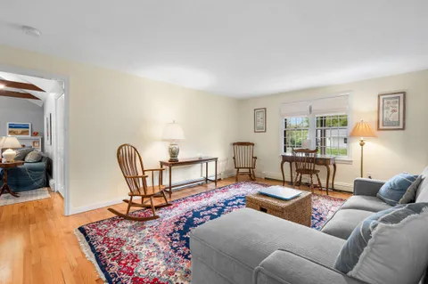 a living room with furniture and a rug