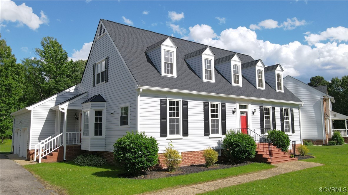 207 Comstock Drive Colonial Heights, VA 23834 - Photo 1 of 44 a front view of a house with garden and porch