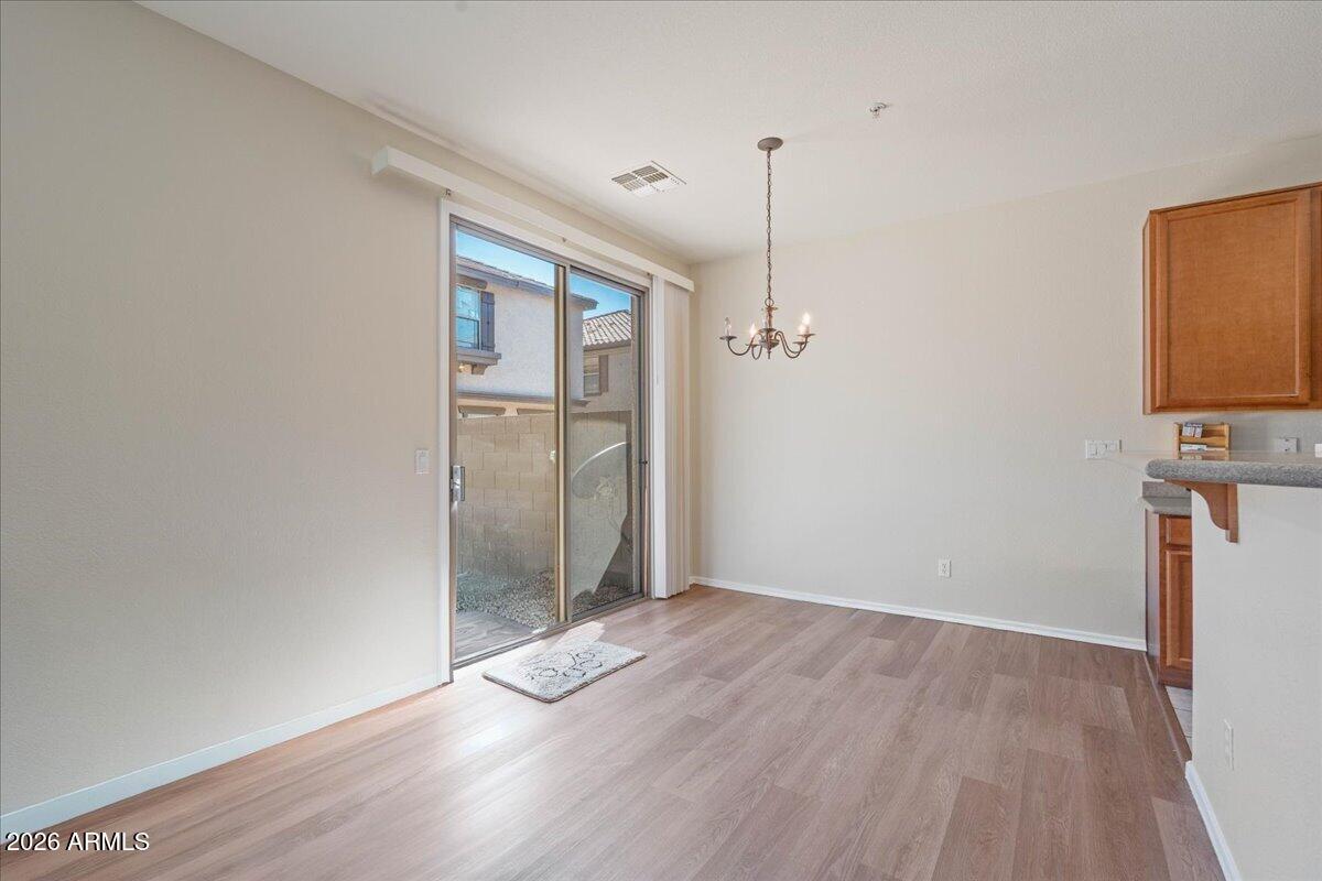 1255 South Rialto, Unit 106 Mesa, AZ 85209 - Photo 9 of 32 a view of empty room with wooden floor