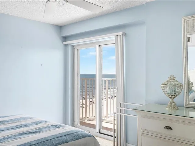 a view of ocean with a multi story building