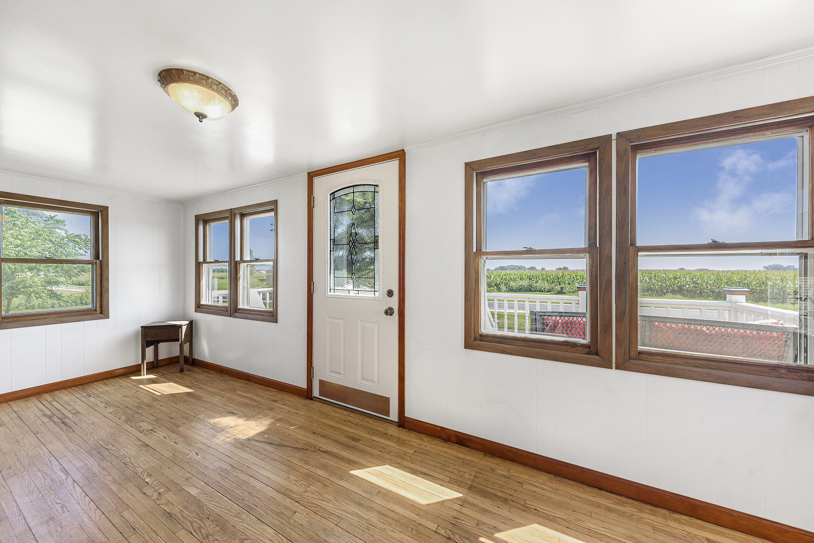 8N680 Percy Road Maple Park, IL 60151 - Photo 5 of 30 a view of an empty room with wooden floor and a window