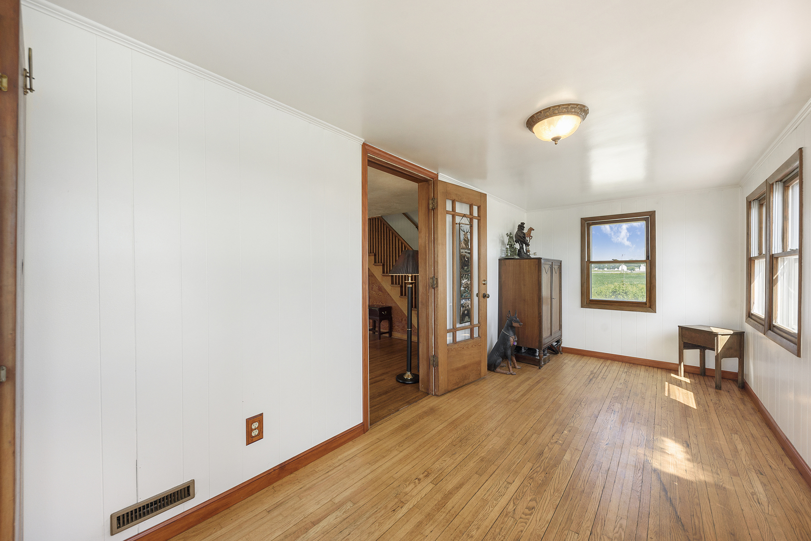 8N680 Percy Road Maple Park, IL 60151 - Photo 6 of 30 a view of a livingroom with wooden floor and a window