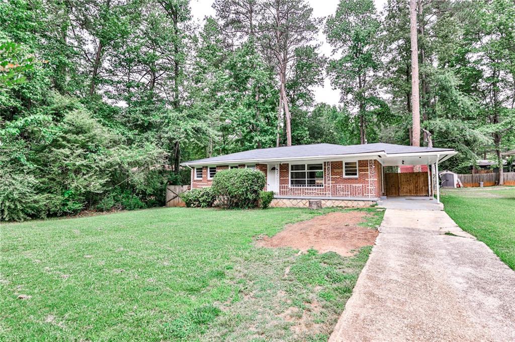 3322 Pinehill Drive Decatur, GA 30032 - Photo 1 of 1 a front view of a house with yard porch and green space