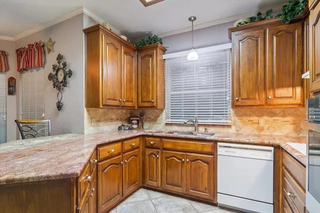 a bathroom with a sink vanity mirror and toilet