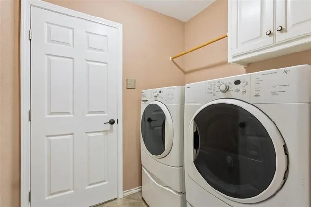 a view of a house with yard and a tree