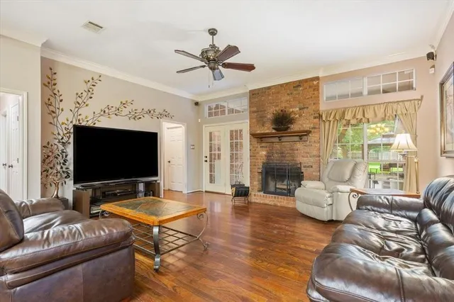 a view of a dining room with furniture and a chandelier