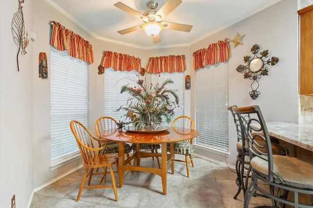 a kitchen with stainless steel appliances a refrigerator a sink a stove and a cabinets
