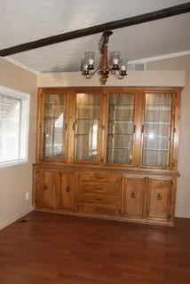 a kitchen with a stove sink and cabinets