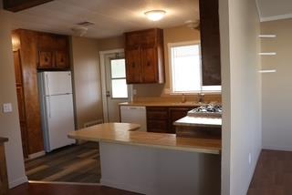 15820 South Harlan Road, Unit 143 Lathrop, CA 95330 - Photo 19 of 40 a kitchen with refrigerator and sink