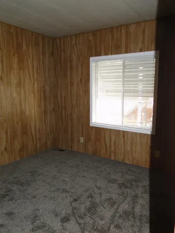 a view of a bathroom with shower curtain