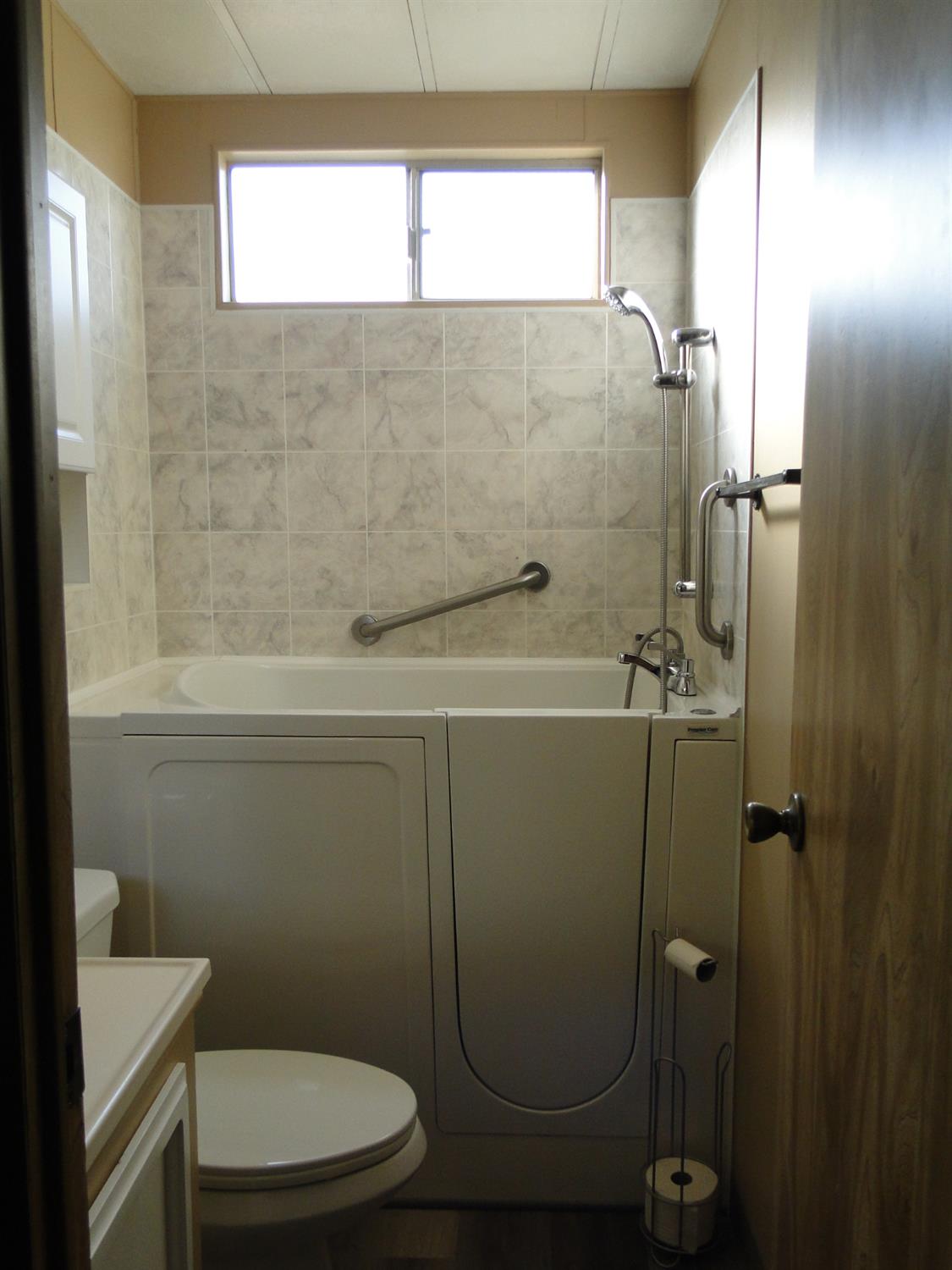 15820 South Harlan Road, Unit 143 Lathrop, CA 95330 - Photo 36 of 40 a bathroom with a toilet and a shower
