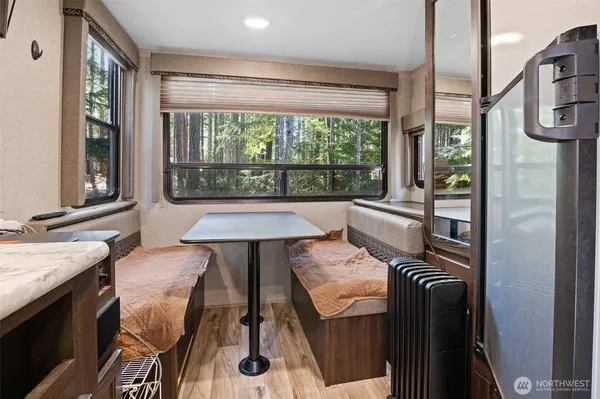 a bedroom with a bed and a wall painting