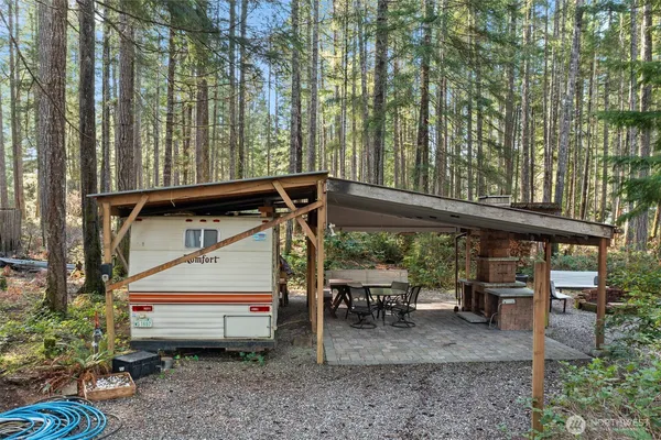 a view of outdoor space with table and chairs