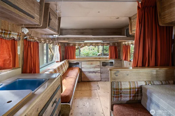 a view of patio with a table and chairs under an umbrella