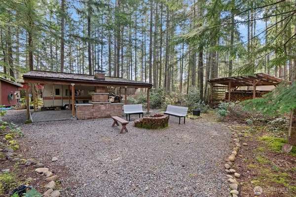 a garden with trees in front of it