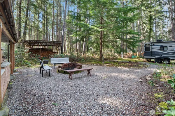 a view of a backyard with a large space and trees