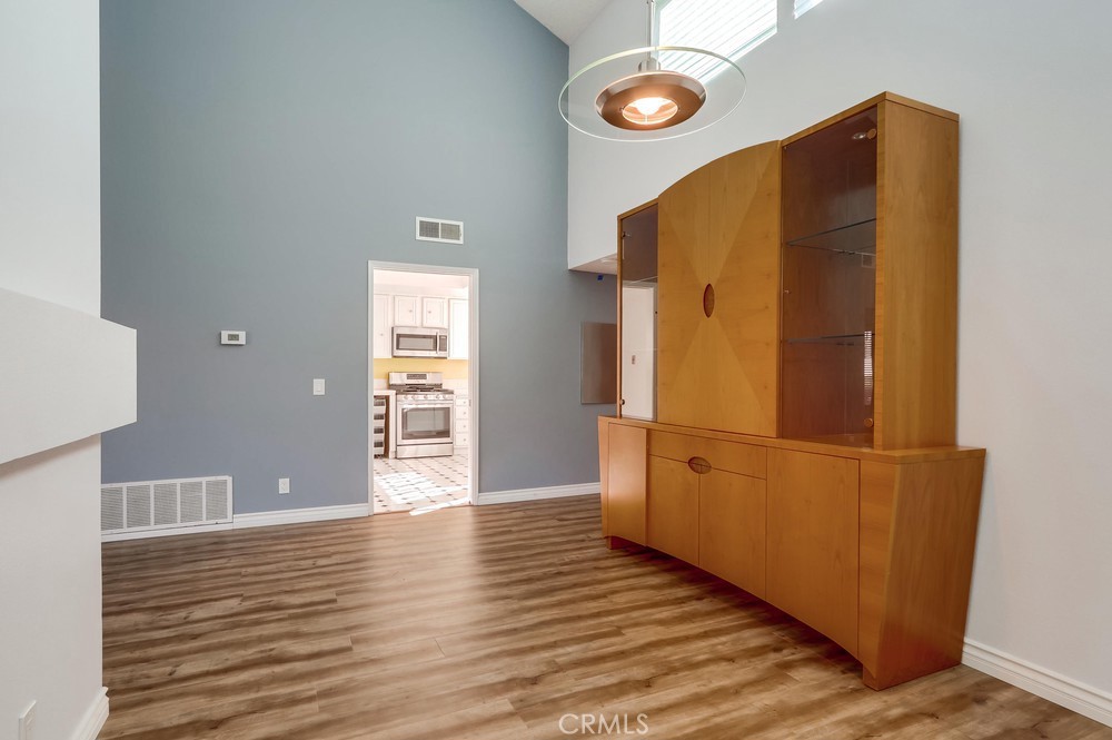 38 Springacre Irvine, CA 92614 - Photo 9 of 19 a view of a refrigerator in kitchen and wooden floor