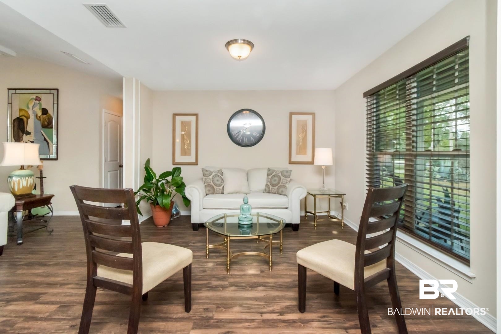 11528 Mocking Bird Lane Fairhope, AL 36532 - Photo 6 of 45 Living area with wood finished floors and baseboards