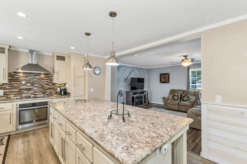 10 Ashleigh Lane, Unit 10 Rochester, NH 03867 - Photo 10 of 42 a kitchen with stainless steel appliances granite countertop a sink and a stove