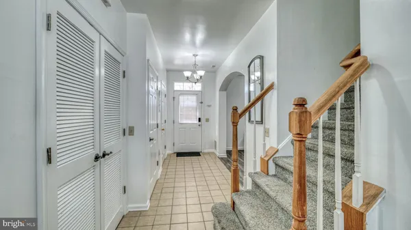 a view of a hallway with a chandelier