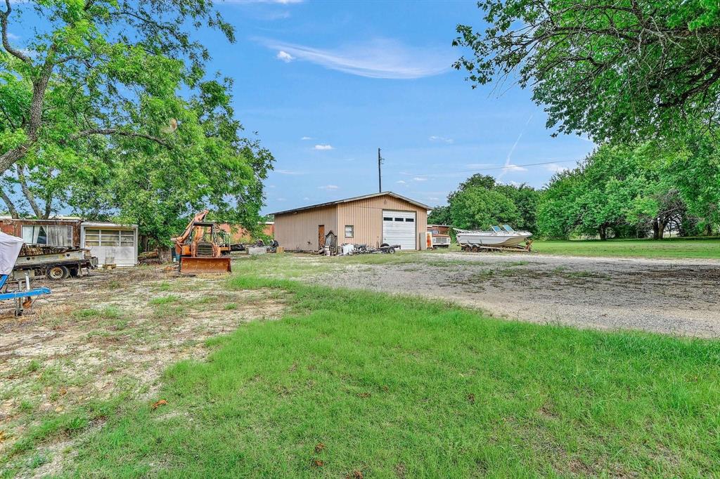3615 Pottsboro Road Denison, TX 75020 - Photo 5 of 5 a front view of a house with garden