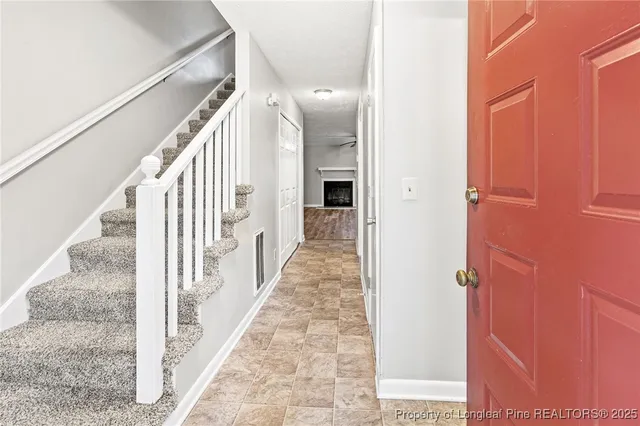 a kitchen with stainless steel appliances granite countertop a stove a microwave and a refrigerator