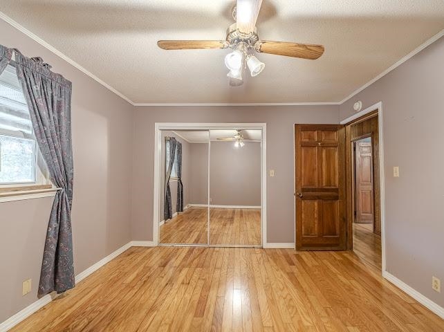 660 Hinton Road Counce, TN 38326 - Photo 20 of 40 Hardwood flooring complemented by a ceiling fan with light fixture