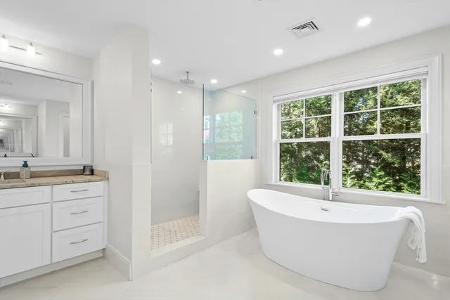 a bathroom with a bathtub and sink