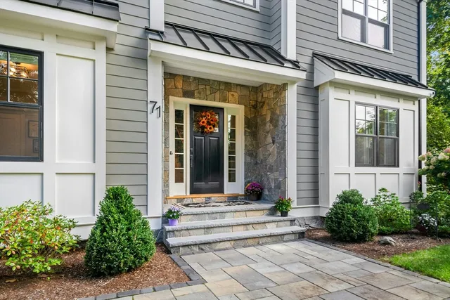 a view of a building with potted plants
