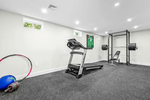 a room with gym equipment and a table
