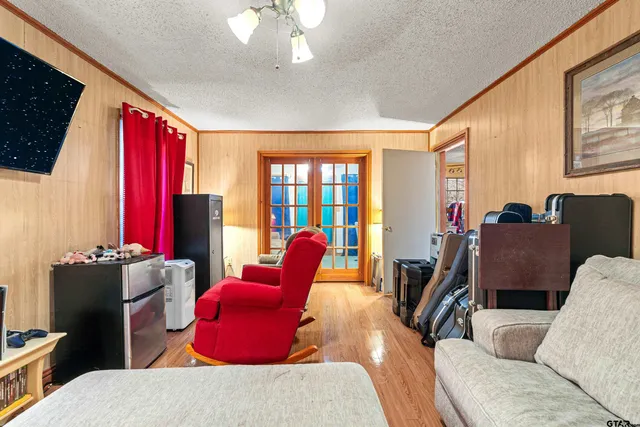 a living room with furniture a rug and a window