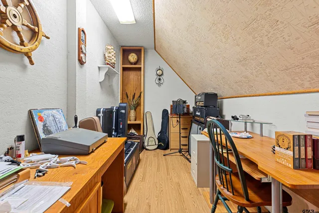 a bedroom with two beds and a dresser