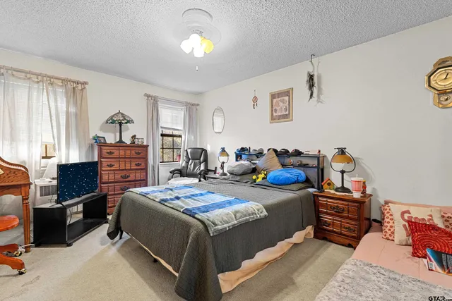 a en suite bathroom with a sink and a large mirror