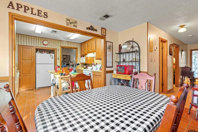 a view of a kitchen with furniture and a window