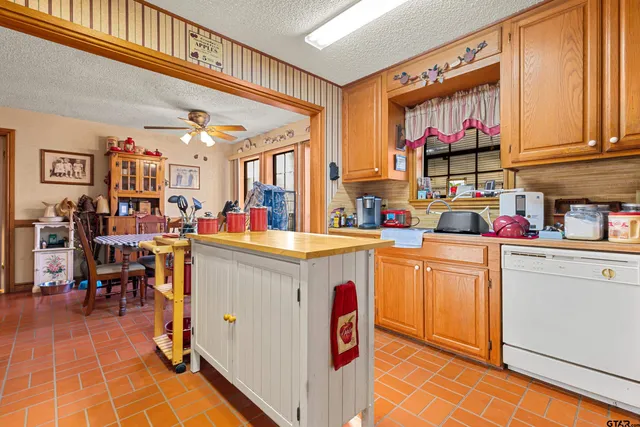 a kitchen with a sink and a refrigerator