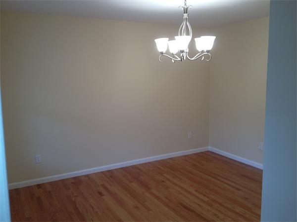 5 Birch Road Freetown, MA 02702 - Photo 16 of 25 a view of a chandelier in big room with wooden floor