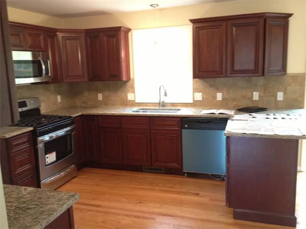5 Birch Road Freetown, MA 02702 - Photo 21 of 25 a kitchen with stainless steel appliances granite countertop a stove a sink and a microwave