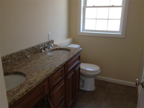 5 Birch Road Freetown, MA 02702 - Photo 6 of 25 a bathroom with a granite countertop sink a toilet and a window