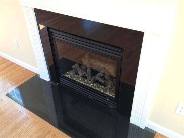 5 Birch Road Freetown, MA 02702 - Photo 10 of 25 a close up of a fireplace in the kitchen