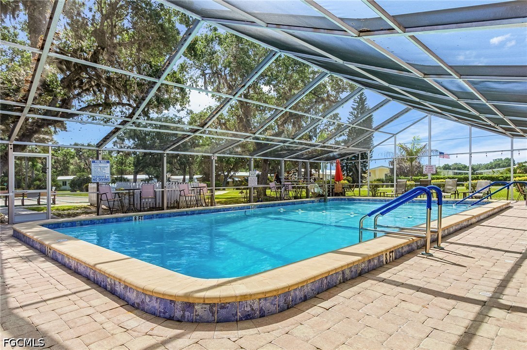 5 Erica Street Alva, FL 33920 - Photo 4 of 37 a view of a swimming pool with a patio