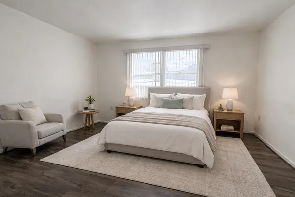 a bedroom with a bed and a couch