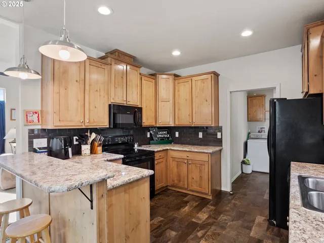 a kitchen with cabinets and stainless steel appliances