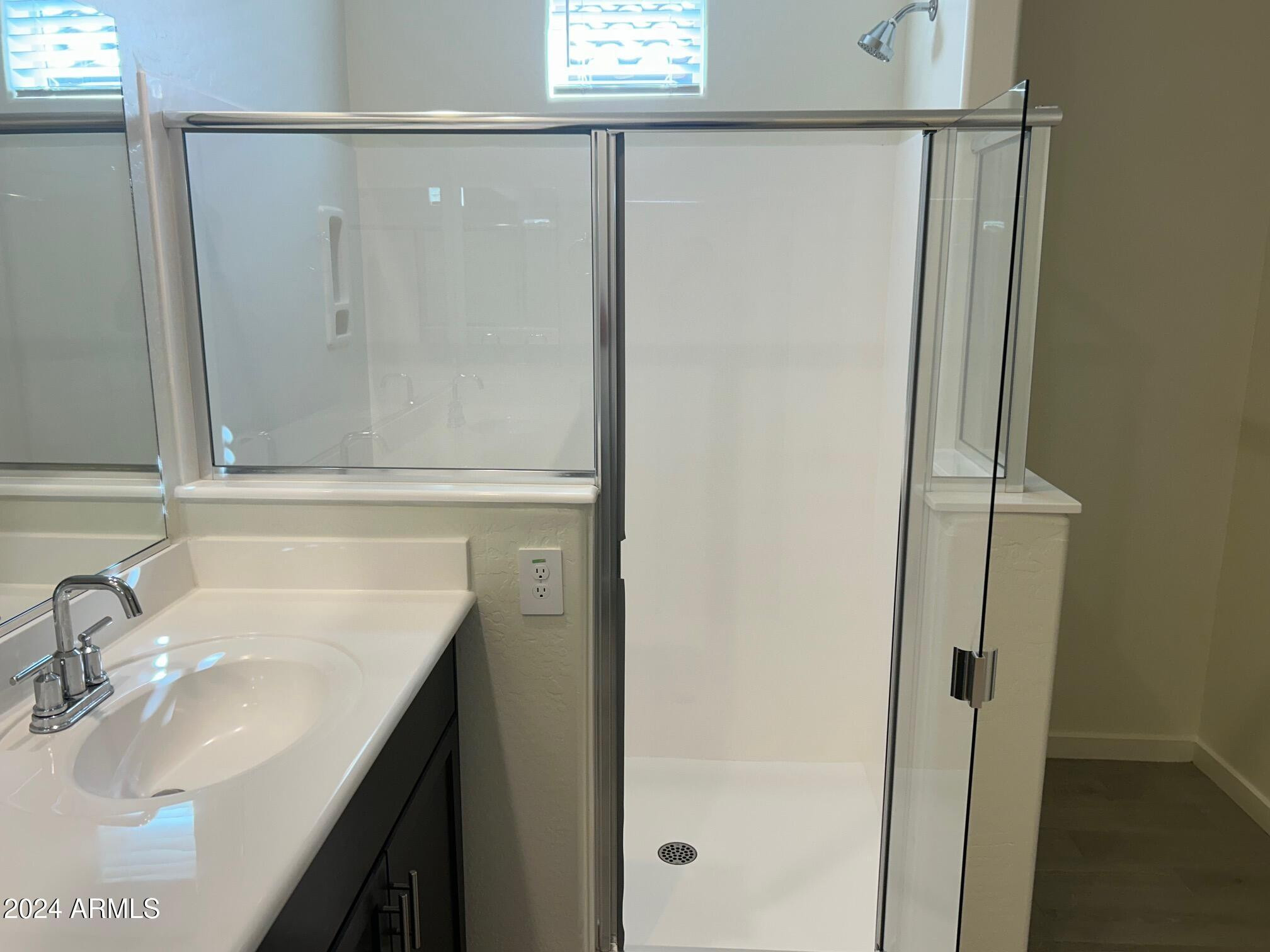 20520 North Candlelight Road Maricopa, AZ 85138 - Photo 15 of 18 a bathroom with a sink and a mirror