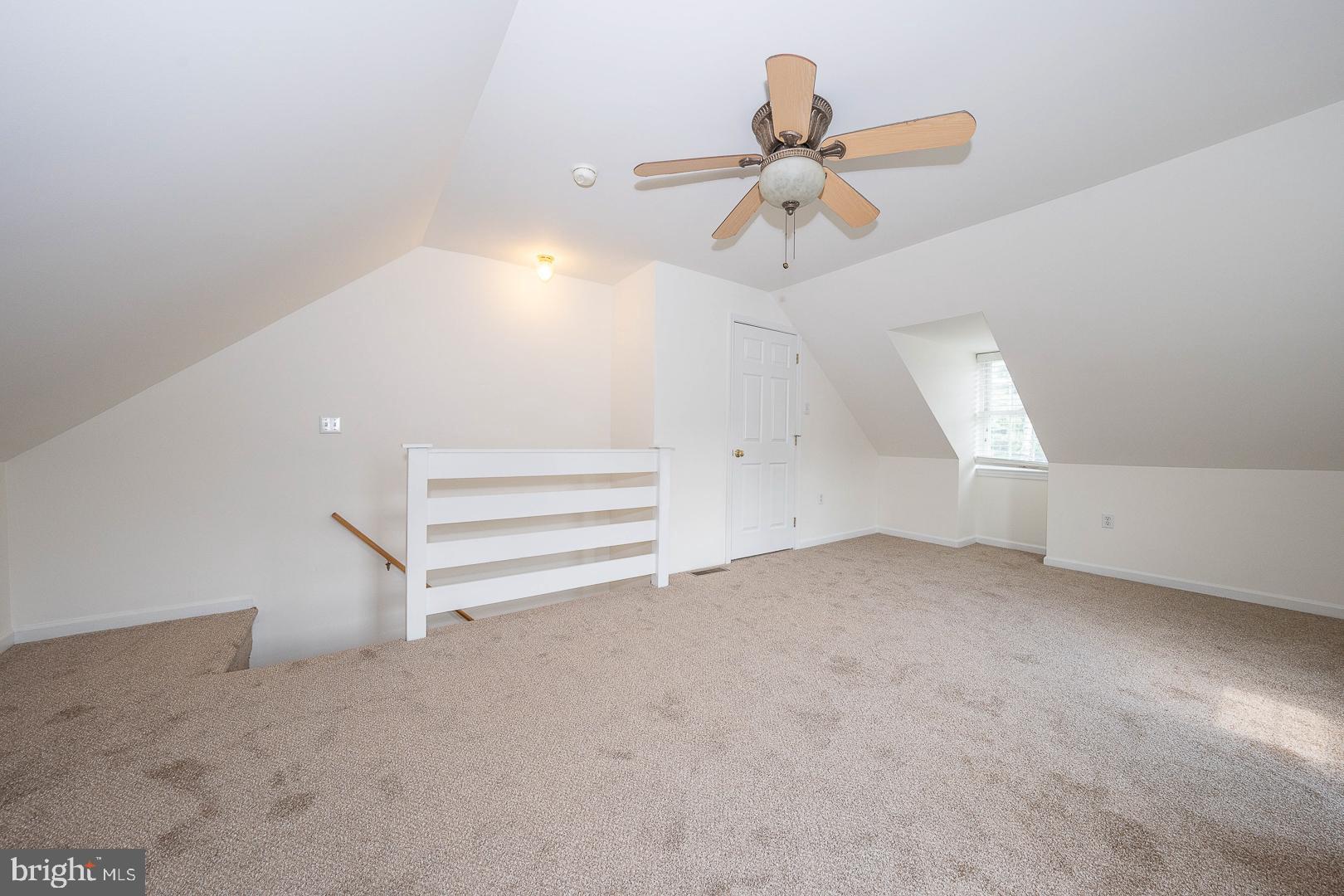 231 Plant Avenue Wayne, PA 19087 - Photo 23 of 35 an empty room with a ceiling fan and window