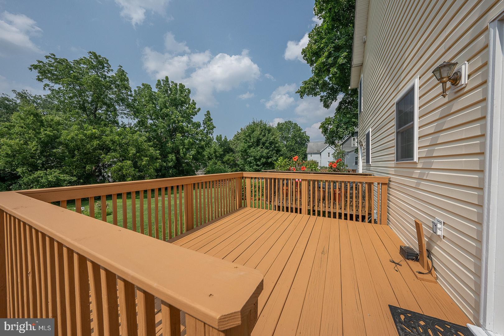 231 Plant Avenue Wayne, PA 19087 - Photo 28 of 35 a view of balcony with wooden floor and fence