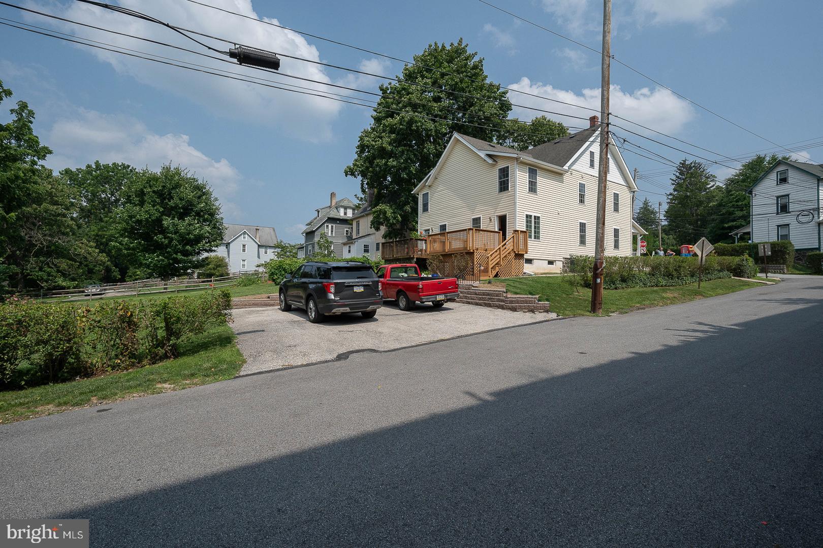 231 Plant Avenue Wayne, PA 19087 - Photo 30 of 35 a car parked in front of a white house