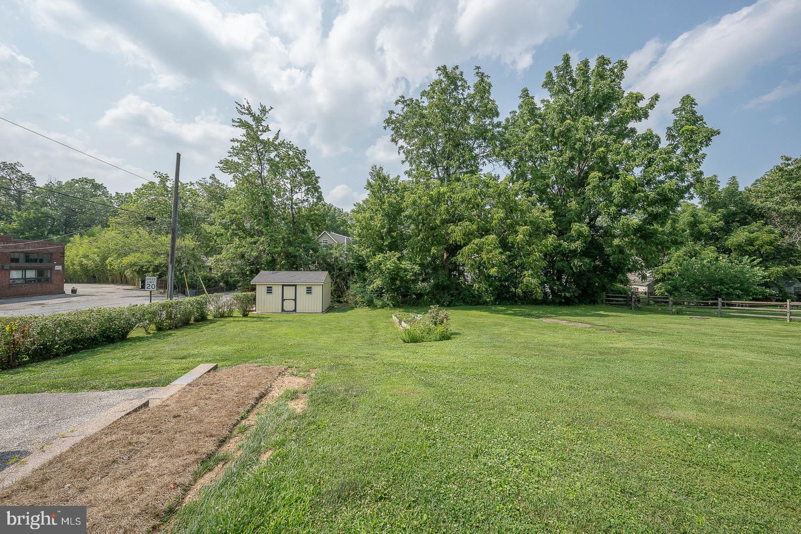 231 Plant Avenue Wayne, PA 19087 - Photo 33 of 35 a house with a yard and trees in the background